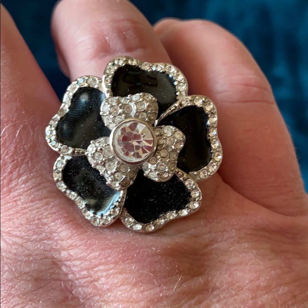 Black enamel and white crystal flower ring.